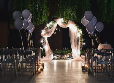 shine-wedding-altar-newlyweds-stands-backyard-decorated-with-balloons
